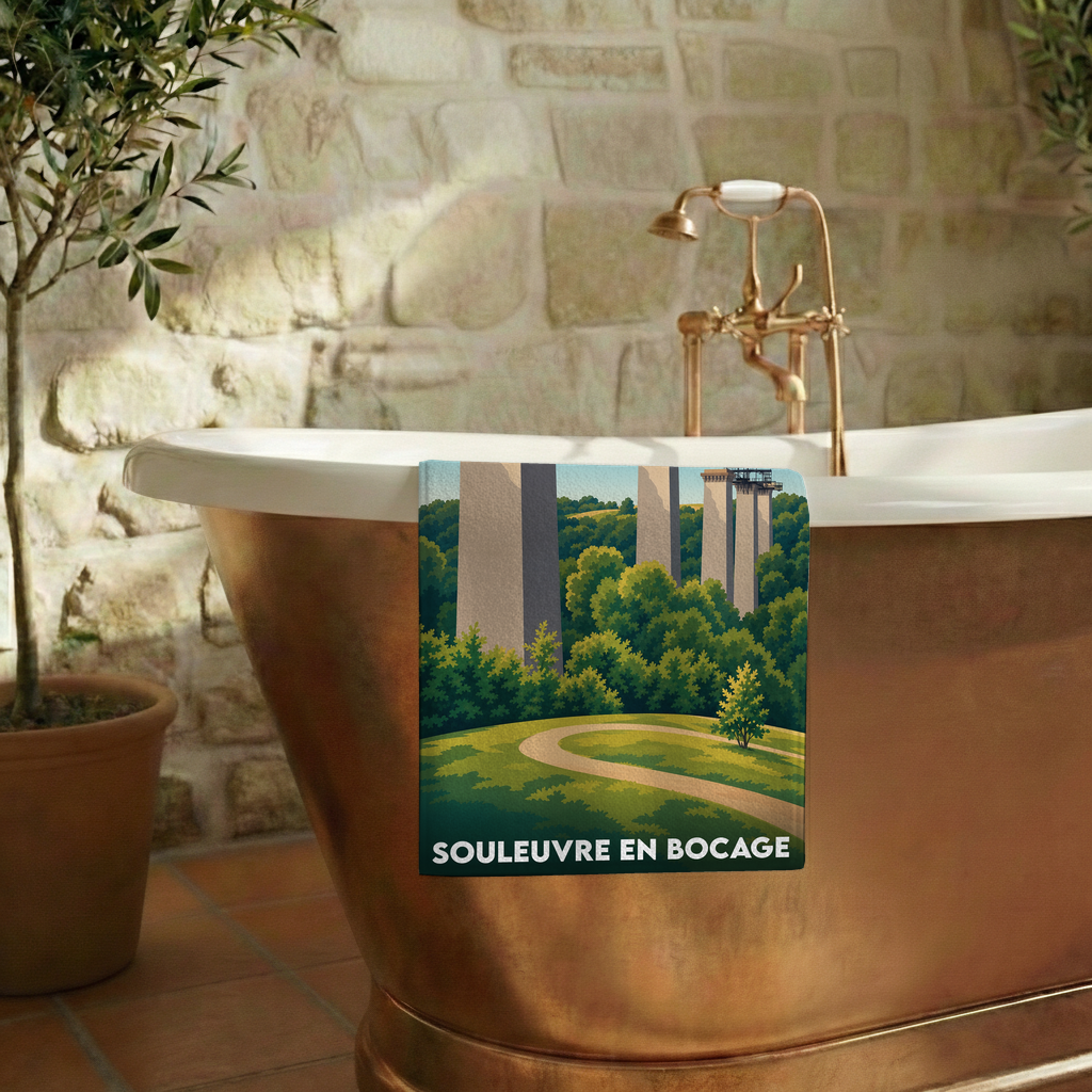 Serviette de bain souvenir de la ville de Souleuvre en Bocage avec une illustration stylisée du viaduc.