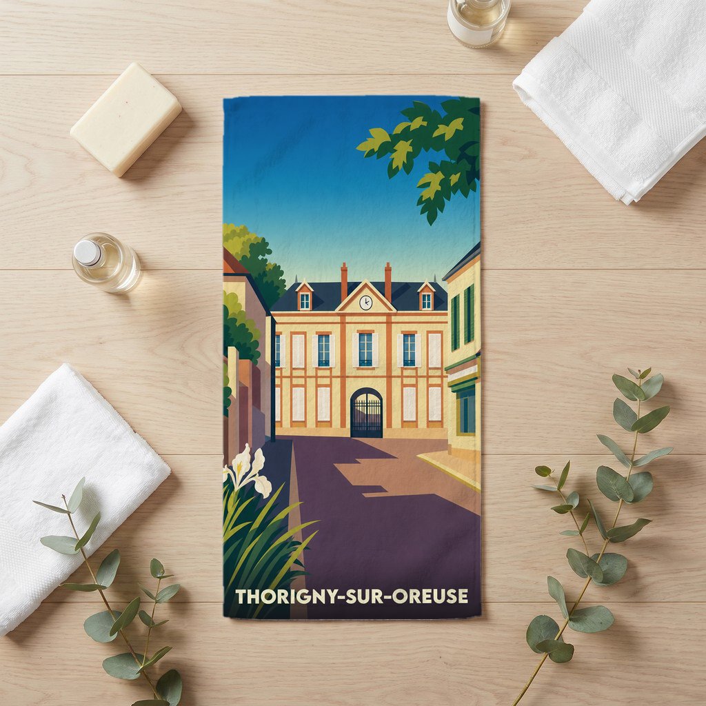 Serviette de bain souvenir de la ville de Thorigny-sur-Oreuse avec une illustration stylisée.