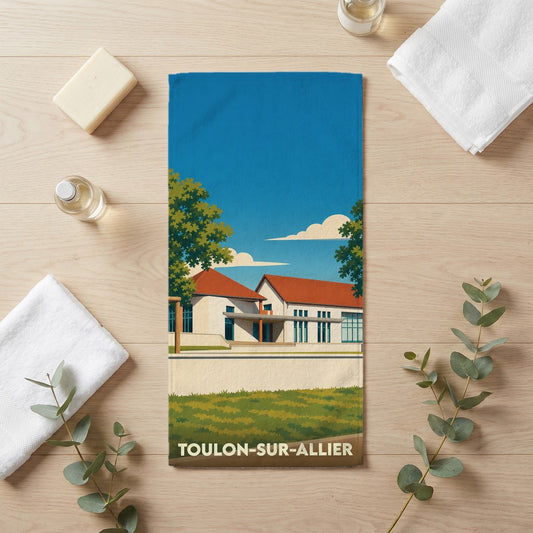 Serviette de bain souvenir de Toulon-sur-Allier avec une illustration stylisée de la ville.