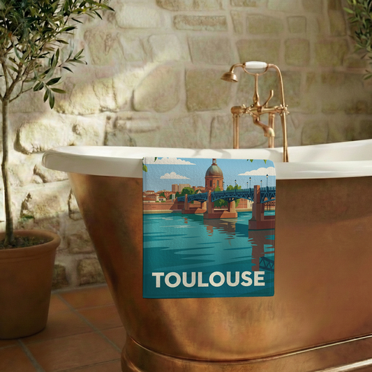 Serviette de bain souvenir de la ville de Toulouse avec une illustration stylisée.
