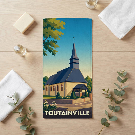 Serviette de bain souvenir de la ville de Toutainville illustrant son église dans un style vintage.
