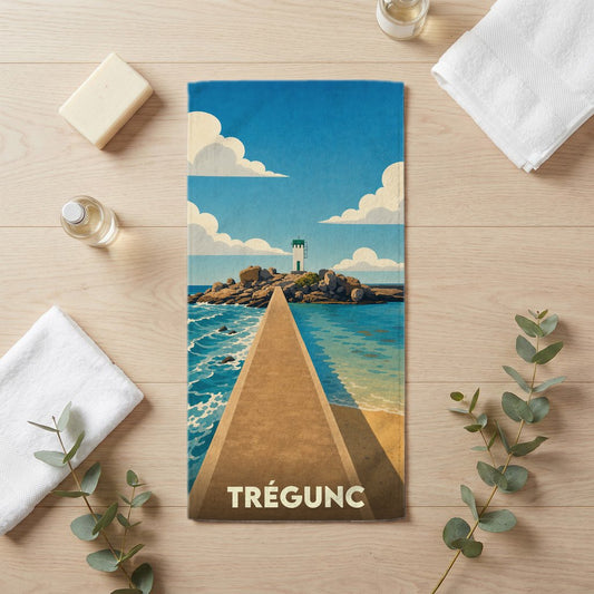 Serviette de bain souvenir de la ville de Trégunc avec une illustration stylisée d'un phare et de sa jetée.
