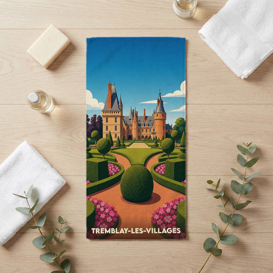 Serviette de bain souvenir de la ville de Tremblay-les-Villages avec une illustration stylisée de château et jardins à la française.
