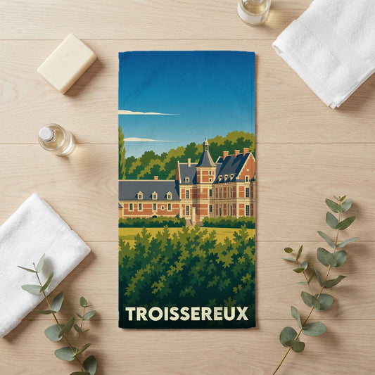 Serviette de bain souvenir de la ville de Troissereux avec une illustration stylisée de son château.