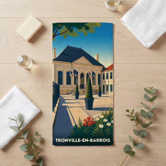 Serviette de bain souvenir de la ville de Tronville-en-Barrois avec une illustration stylisée de son hôtel de ville.