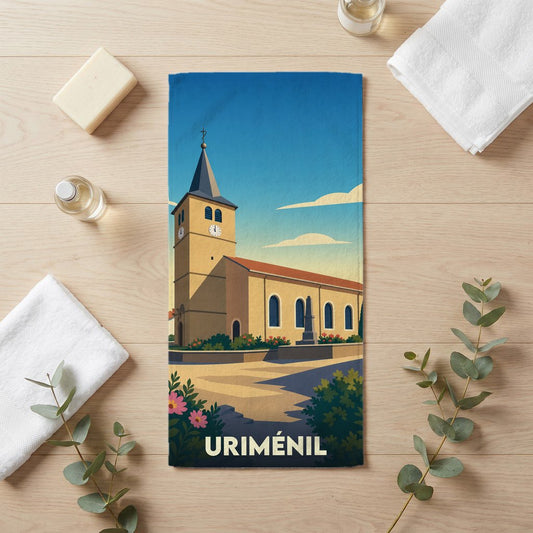Serviette de bain souvenir de la ville de Uriménil avec une illustration stylisée de son église.