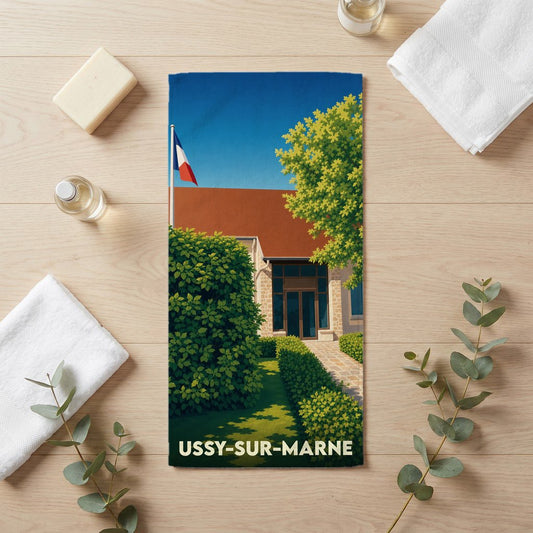 Serviette de bain souvenir de la ville d'Ussy-sur-Marne avec une illustration stylisée.