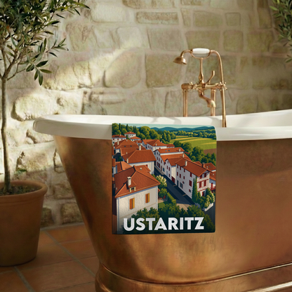 Serviette de bain souvenir de la ville de Ustaritz avec une illustration stylisée.