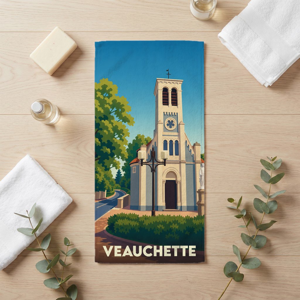 Serviette de bain souvenir de la ville de Veauchette avec une illustration stylisée de son église.