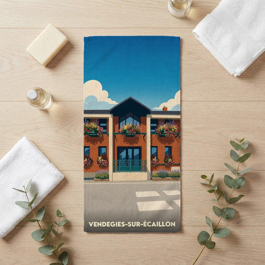 Serviette de bain souvenir de la ville de Vendegies-sur-Écaillon avec une illustration stylisée.