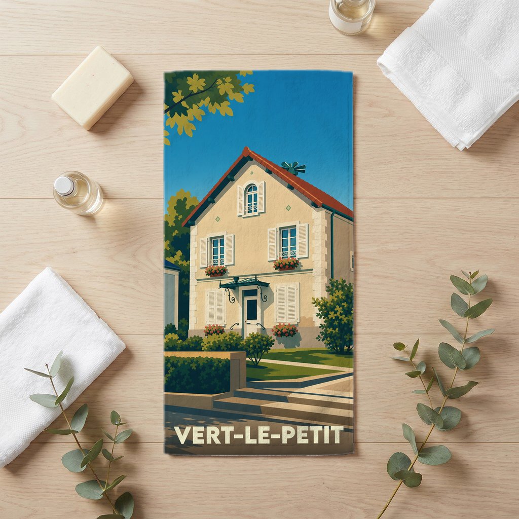 Serviette de bain souvenir de la ville de Vert-le-Petit avec une illustration stylisée d'une maison.