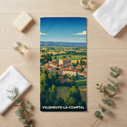 Serviette de bain souvenir de Villeneuve-la-Comptal avec une illustration de paysage champêtre stylisé.