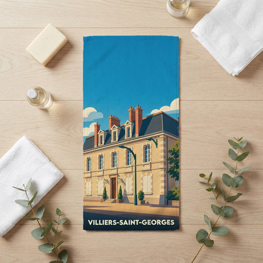Serviette de bain souvenir de Villiers-Saint-Georges illustrée d'une bâtisse élégante sous un ciel bleu.