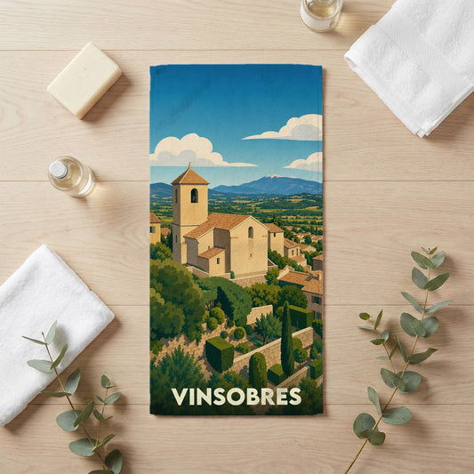 Serviette de bain souvenir de la ville de Vinsobres avec une illustration stylisée de son église et de ses paysages provençaux.