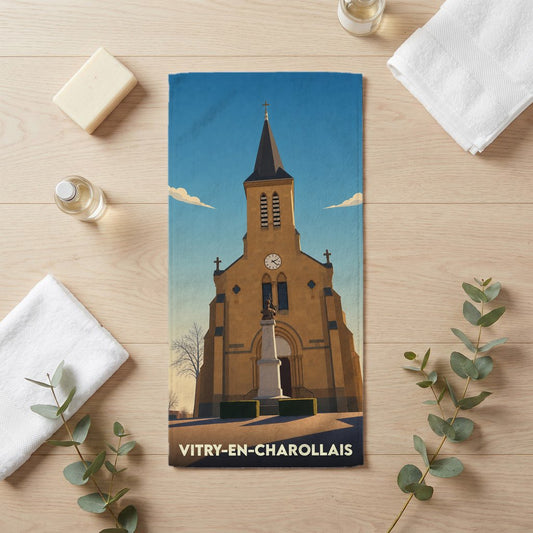 Serviette de bain souvenir de la ville de Vitry-en-Charollais avec une illustration stylisée de son église.