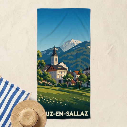 Serviette de bain souvenir de Viuz-en-Sallaz avec une illustration stylisée d'un village de montagne.