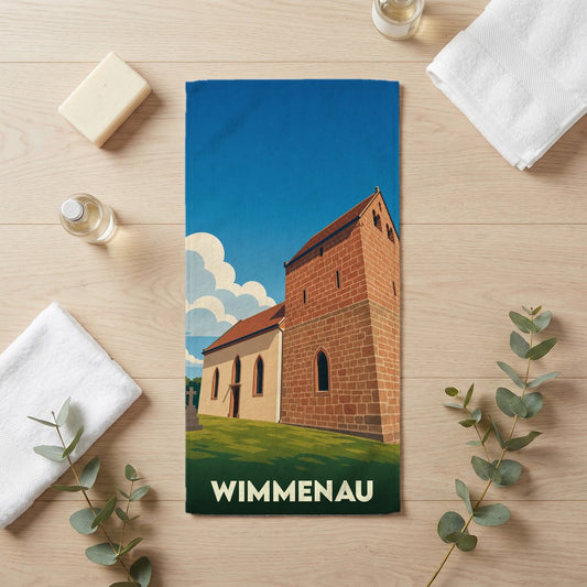 Serviette de bain souvenir de la ville de Wimmenau avec une illustration stylisée de son église historique.