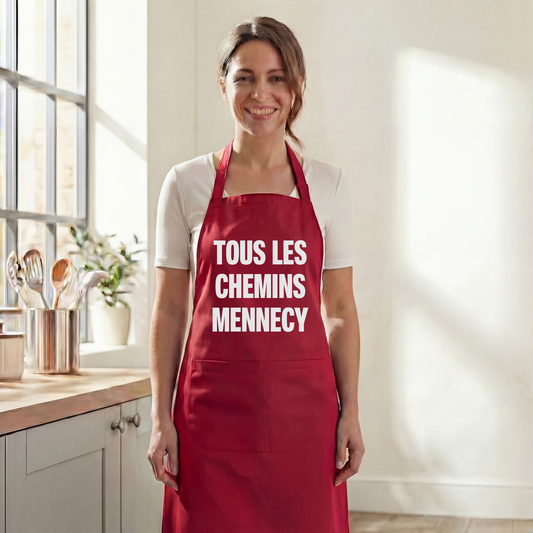 Tablier de cuisine rouge souvenir de la ville de Mennecy avec l'inscription "Tous les chemins Mennecy".