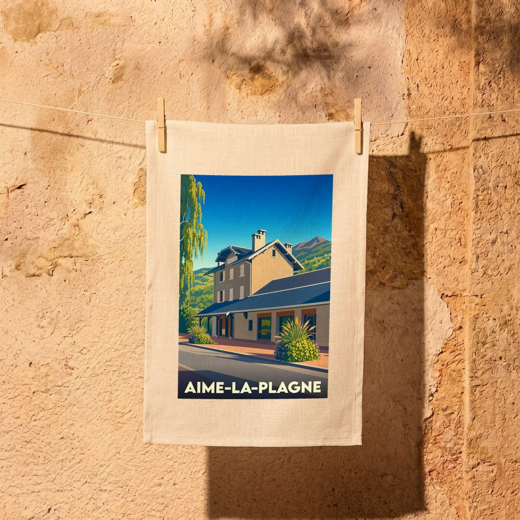 Torchon souvenir de la ville d'Aime-la-Plagne avec une illustration stylisée.