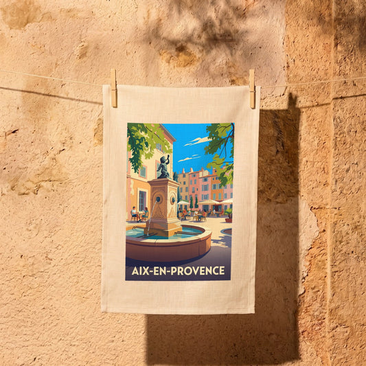 Torchon souvenir de la ville d'Aix-en-Provence avec une illustration stylisée d'une place ensoleillée.