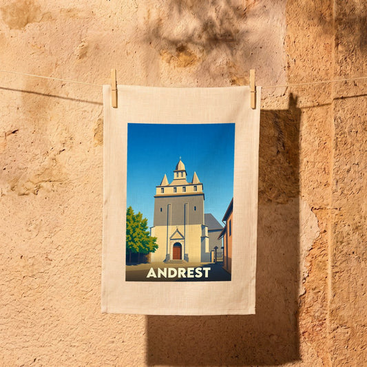 Torchon souvenir de la ville d'Andrest avec une illustration stylisée de son église fortifiée.