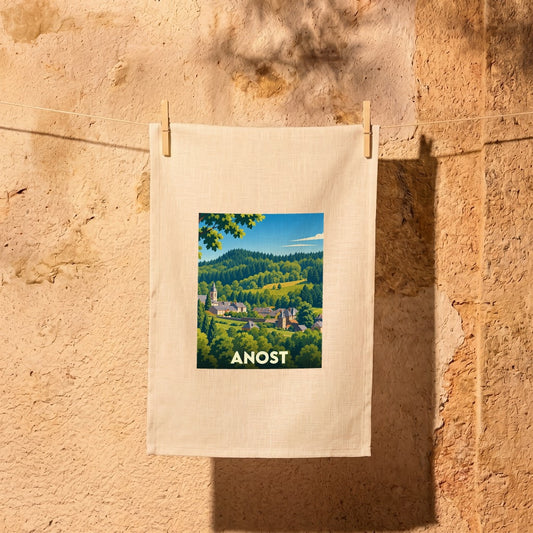Torchon souvenir de la ville d'Anost orné d'une illustration paysagère stylisée.
