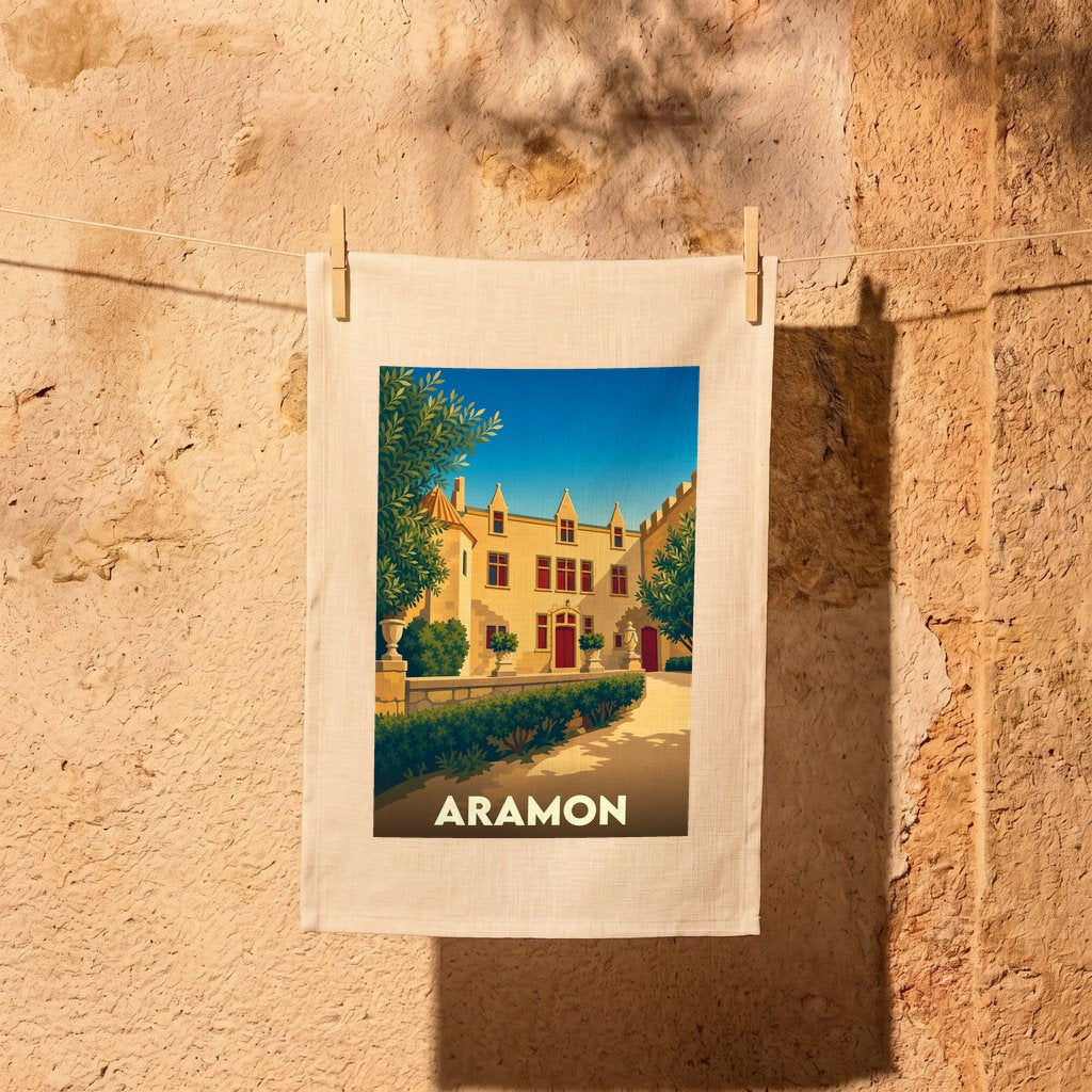 Torchon souvenir de la ville d'Aramon avec une illustration stylisée d'un château provençal.