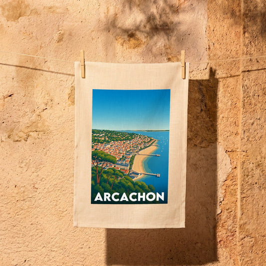 Torchon souvenir de la ville d'Arcachon avec une illustration stylisée du front de mer.