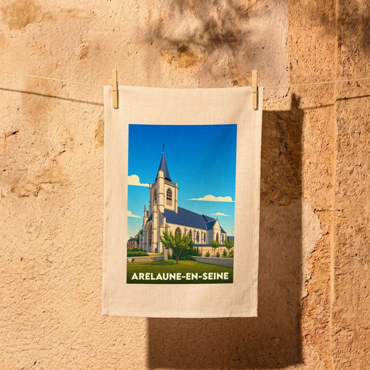 Torchon souvenir de la ville d'Arelaune-en-Seine avec une illustration stylisée de son église sous un ciel bleu.