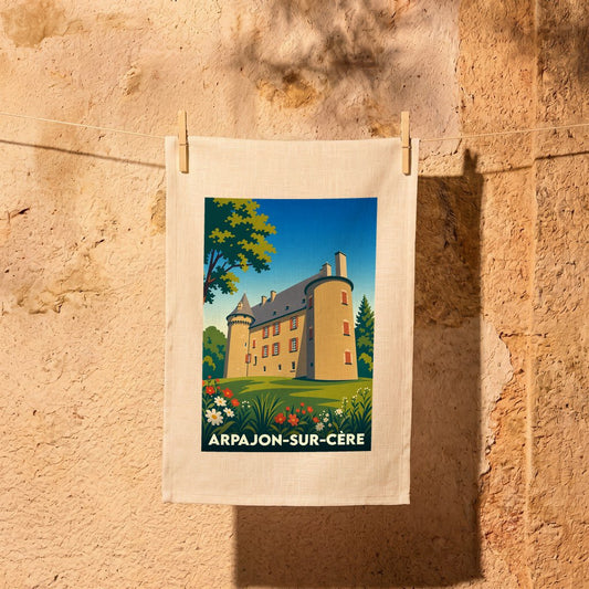 Torchon souvenir de la ville d'Arpajon-sur-Cère illustrant le château de Conros dans un style rétro.