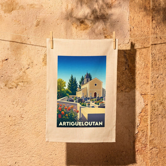 Torchon souvenir de la ville d'Artigueloutan illustrant son église et son cimetière dans un style rétro.