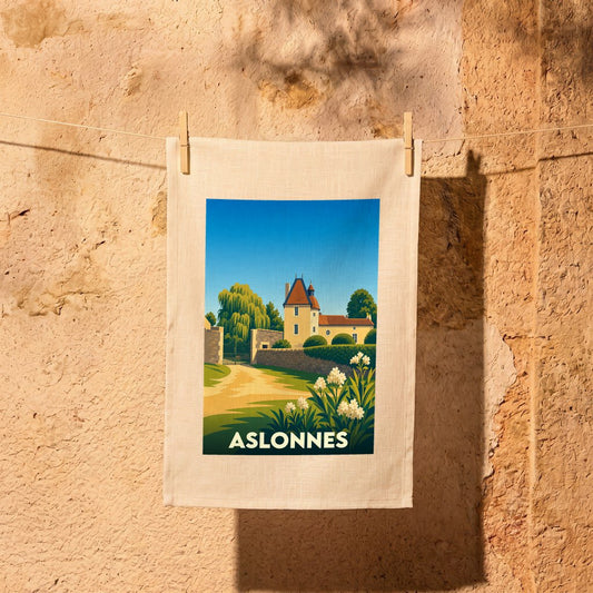 Torchon souvenir de la ville d'Aslonnes avec une illustration stylisée d'un manoir et son jardin.