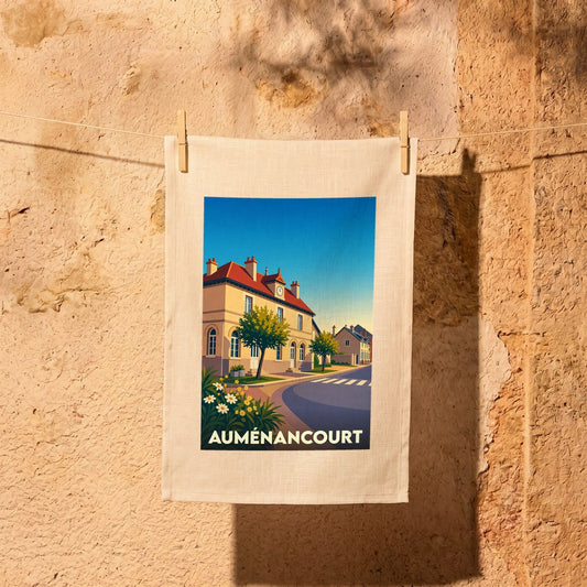 Torchon souvenir de la ville d'Auménancourt orné d'une illustration stylisée de ses rues et bâtiments.