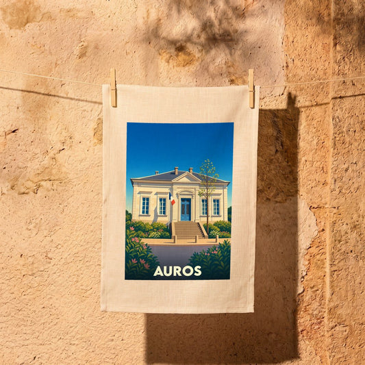 Torchon souvenir de la ville d'Auros illustré d'une vue stylisée de la mairie.