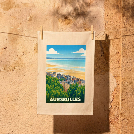 Torchon souvenir de la ville de Aurseulles avec une illustration stylisée d'un paysage côtier normand.