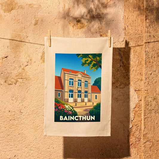 Torchon souvenir de la ville de Baincthun avec une illustration stylisée d'une demeure traditionnelle.