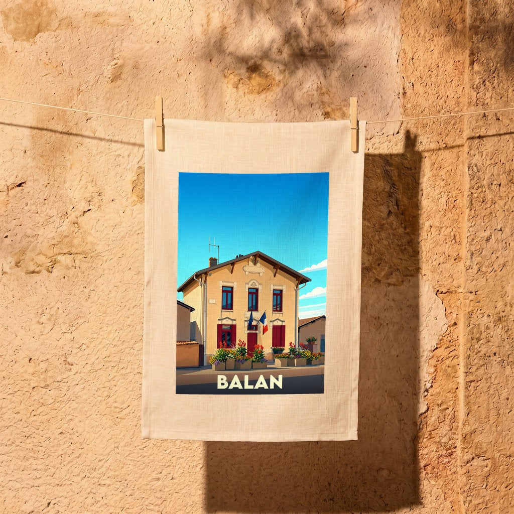 Torchon souvenir de la ville de Balan avec une illustration stylisée.