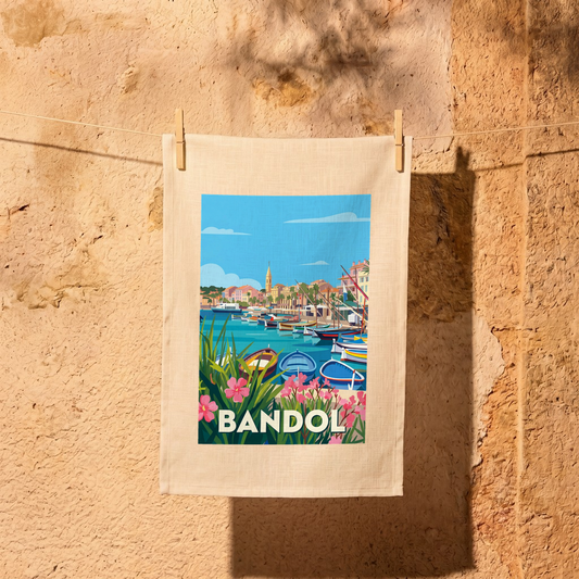 Torchon souvenir de la ville de Bandol avec une illustration stylisée et colorée de son port.