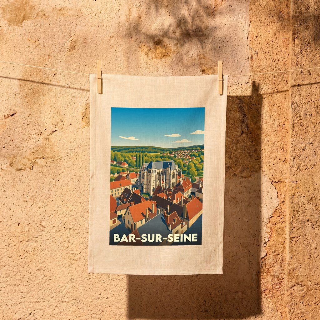 Torchon souvenir de Bar-sur-Seine orné d'une illustration stylisée de la ville et de son église historique.