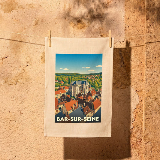 Torchon souvenir de Bar-sur-Seine orné d'une illustration stylisée de la ville et de son église historique.