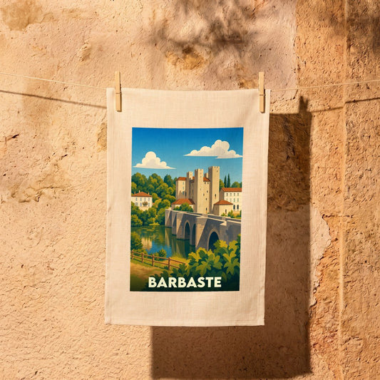 Torchon souvenir de la ville de Barbaste avec une illustration stylisée de son célèbre pont et moulin.