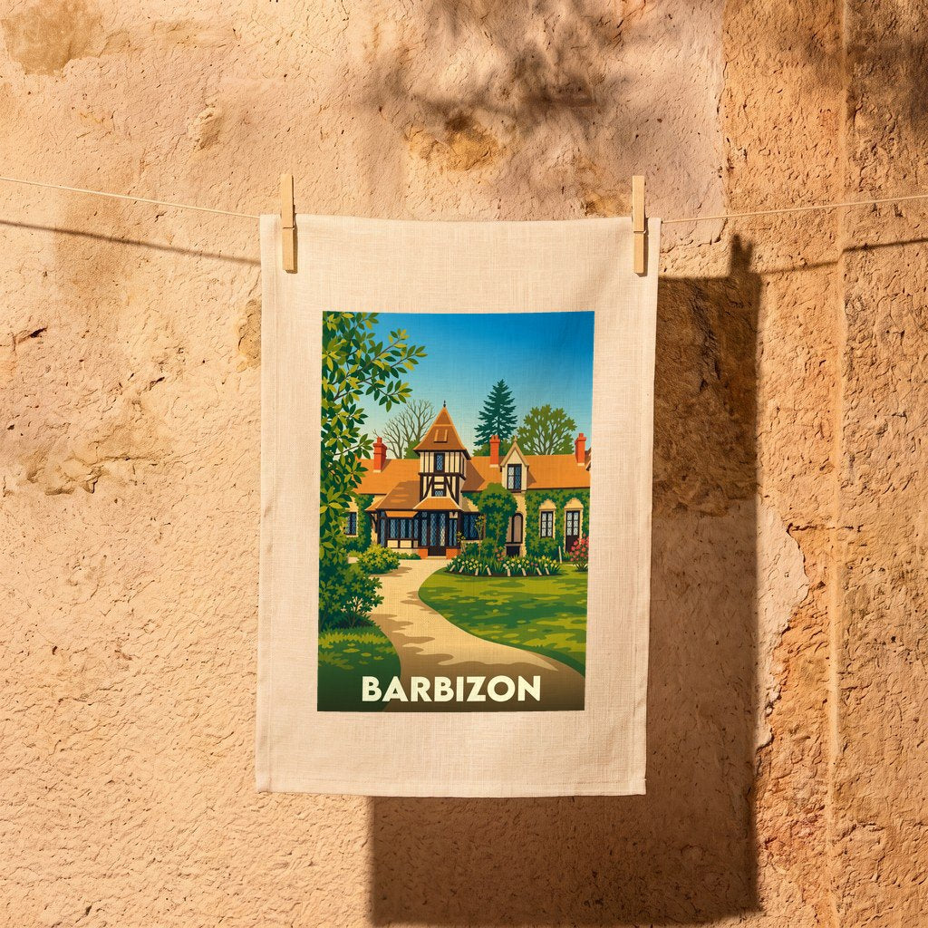 Torchon souvenir de la ville de Barbizon avec une illustration stylisée d'une maison de campagne.