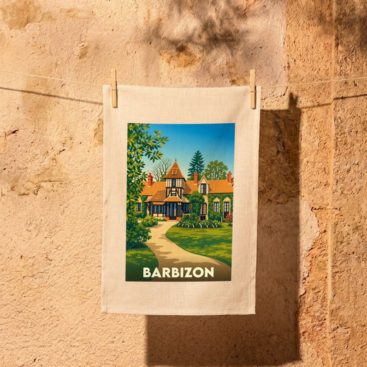 Torchon souvenir de la ville de Barbizon avec une illustration stylisée d'une maison de campagne.