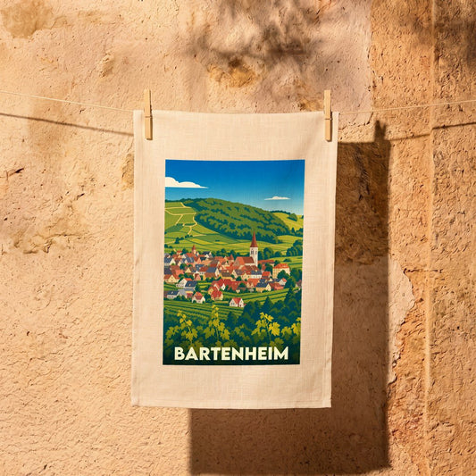 Torchon souvenir de la ville de Bartenheim avec une illustration stylisée d'un village alsacien entouré de vignobles.