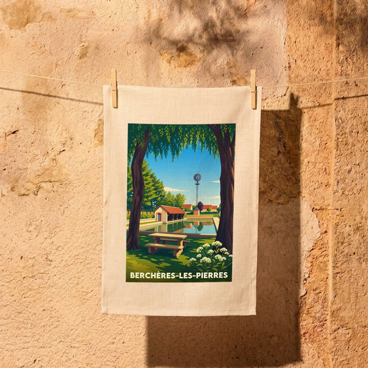 Torchon souvenir de la ville de Berchères-les-Pierres avec une illustration stylisée d'un paysage local.