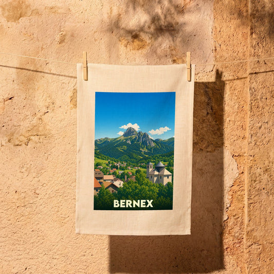 Torchon souvenir de la ville de Bernex avec une illustration stylisée de montagne et du village.