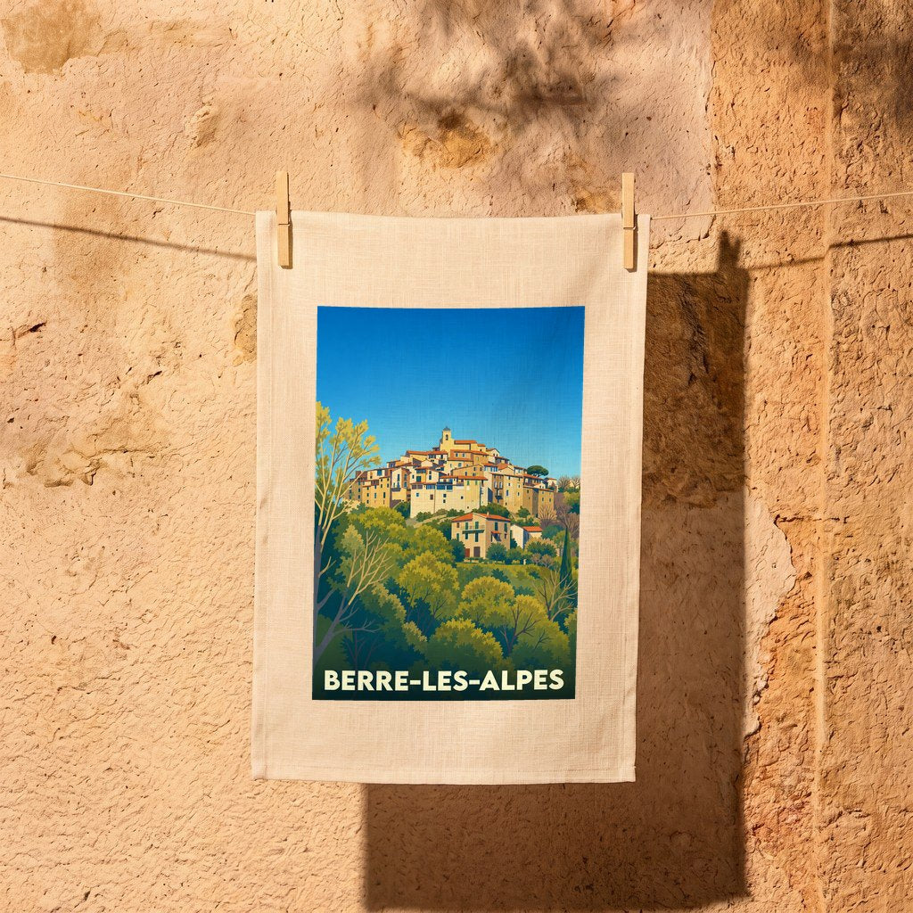 Torchon souvenir de la ville de Berre-les-Alpes avec une illustration stylisée d'un village perché.