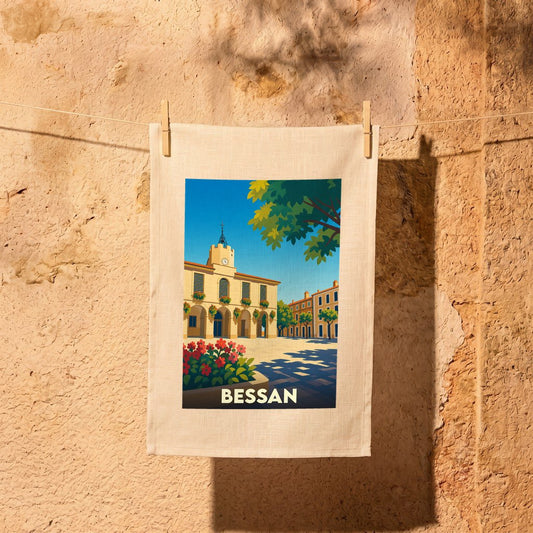 Torchon souvenir de la ville de Bessan illustré d'un dessin stylisé de sa mairie sous un ciel bleu.