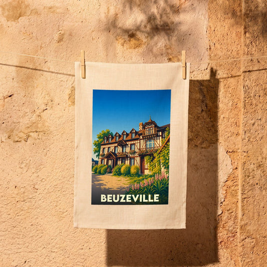 Torchon souvenir de la ville de Beuzeville avec une illustration stylisée d'une bâtisse normande.