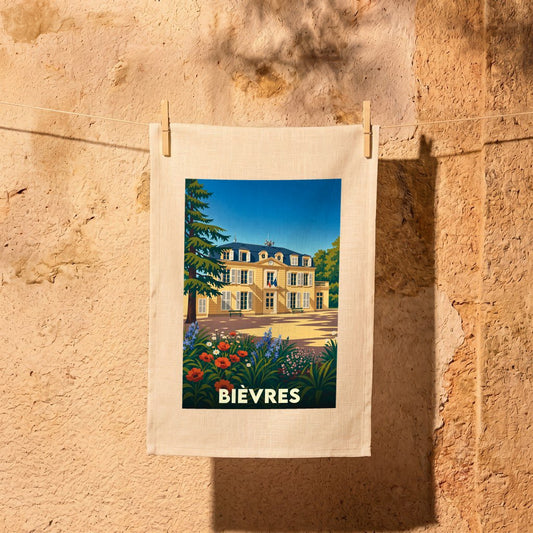 Torchon souvenir de la ville de Bièvres avec une illustration stylisée d'un château fleuri.